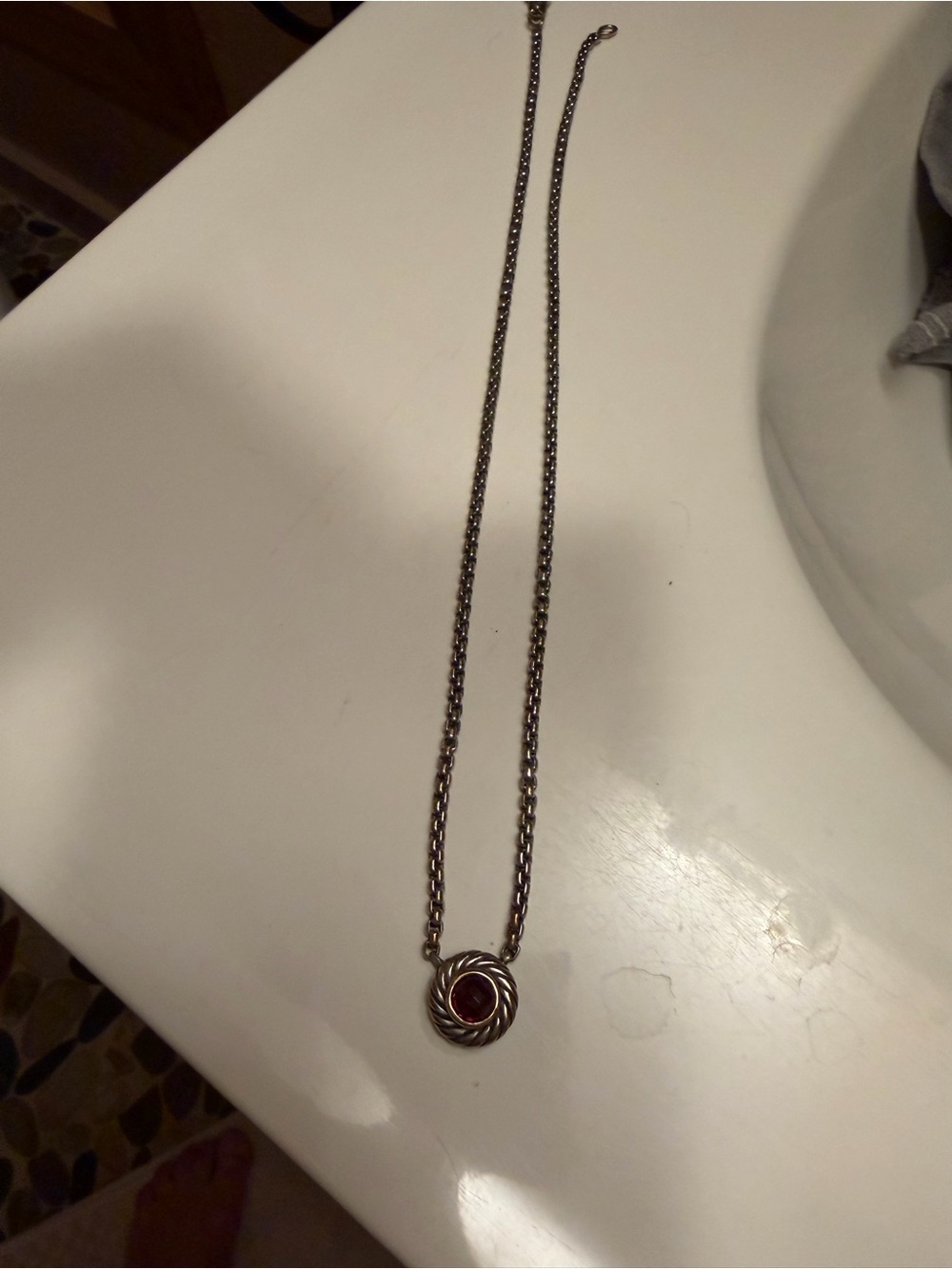 Lagos necklace, ruby or garnet stone, not sure